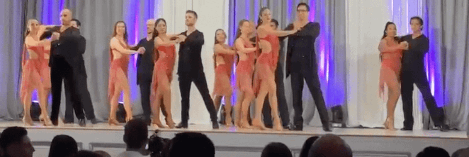 San Tropez salsa team performing on stage in Toronto